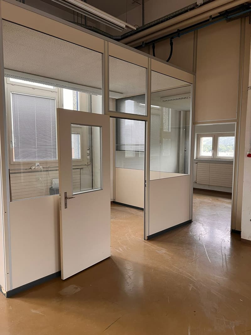 Open doorway, glass panels, electrical outlets, blinds, windows