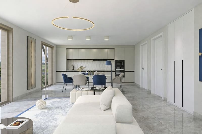 modern living room with white couch, dining table, kitchen, large windows