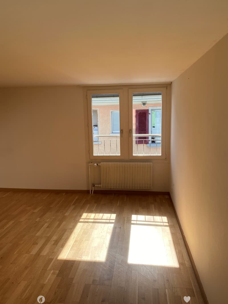 empty room, wooden floor, white walls, large window, balcony