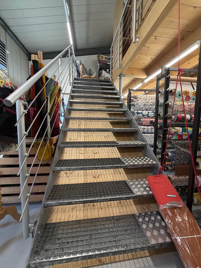 modern staircase with metal railings and metal steps