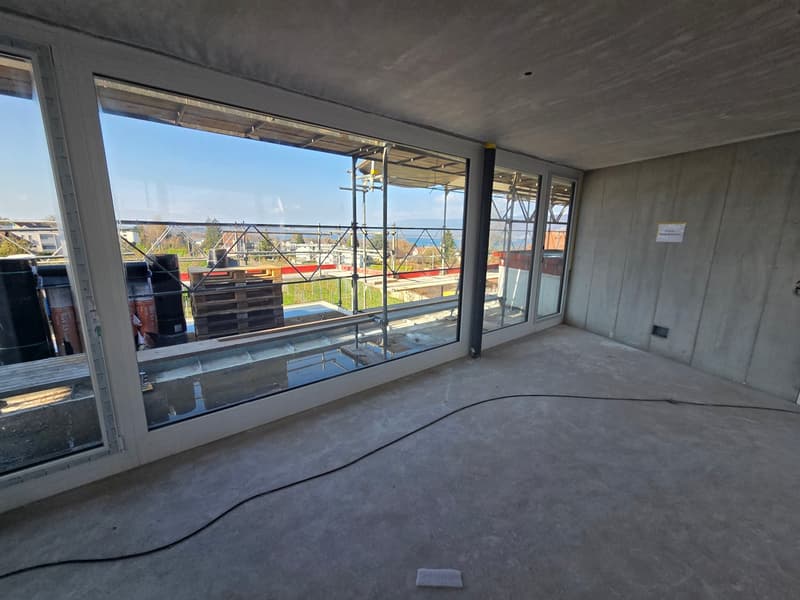 large windows, concrete floor, empty room, construction site view