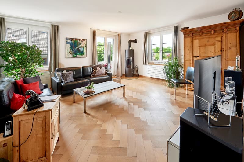 wooden floor, leather sofa, wooden coffee table, fireplace, radiator, picture, window