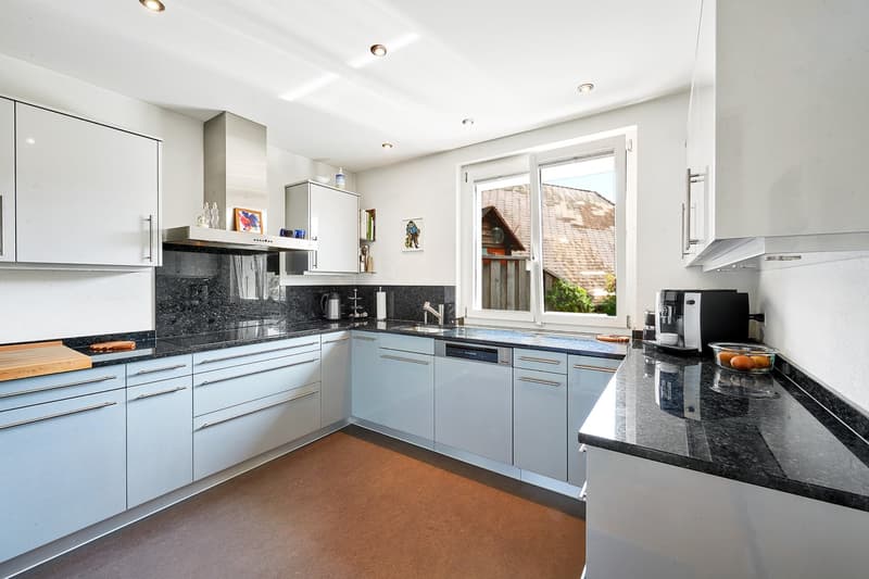modern kitchen, granite countertops, white cabinets, stainless steel appliances, black granite countertop, dishwasher, coffee maker