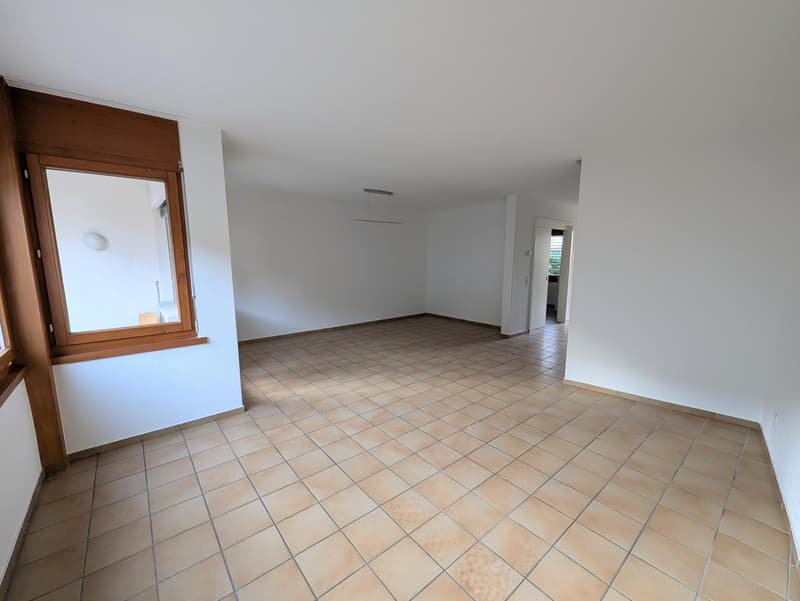 empty room, white walls, tiled floor, large window, wooden window frame