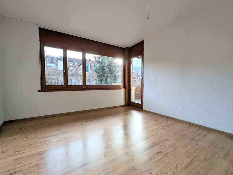 empty room, wooden floor, large windows, sliding door, white walls