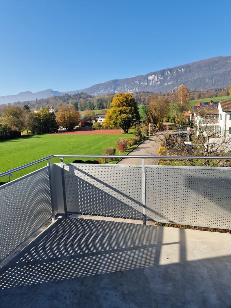 outdoor terrace with railing, view of landscape