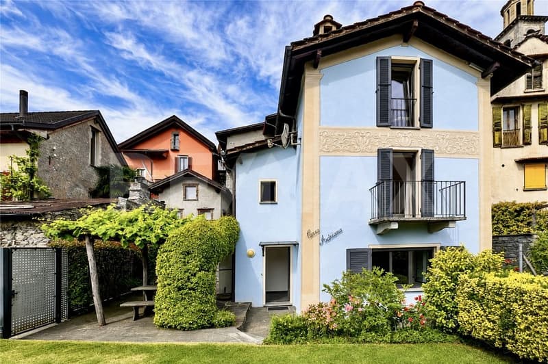 Casa con giardino e 4 posteggi (1)