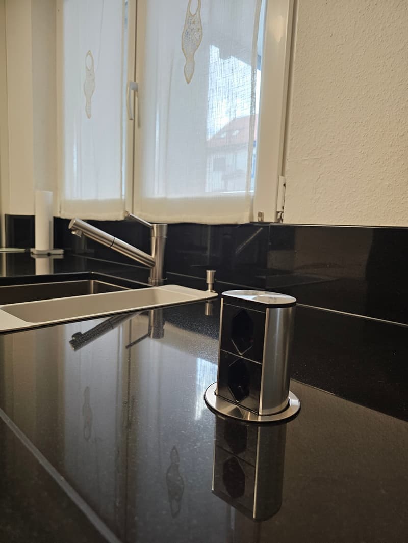 Peaceful living, close to the city in a 4-room apartment with balcony including 1 parking space in Binningen (11)