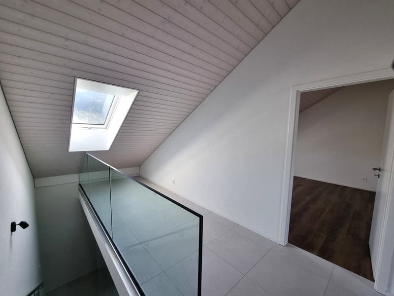 Skylight, glass railing, tile floor, wooden floor
