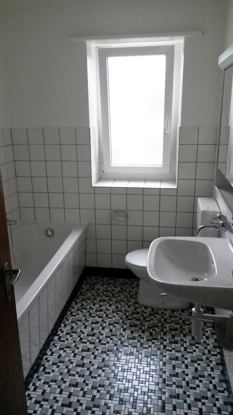 Bathtub, sink, toilet, window, tiled walls and floor