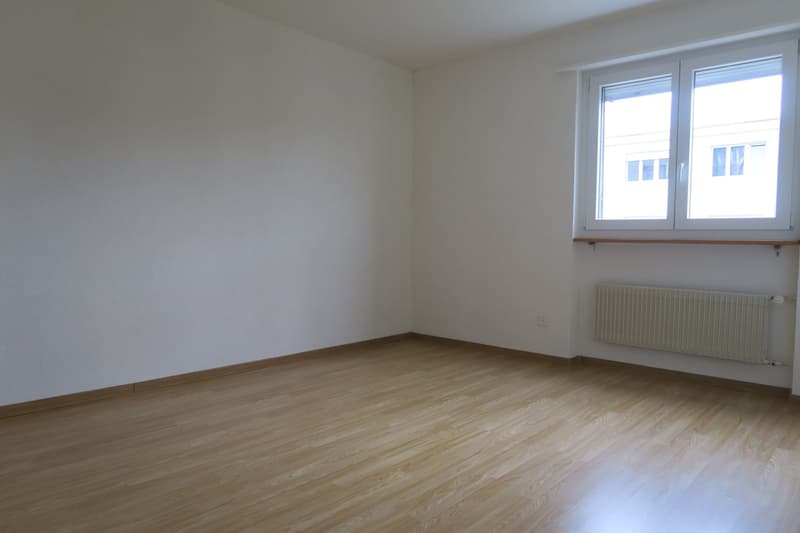 empty room, wooden floors, white walls, window, radiator