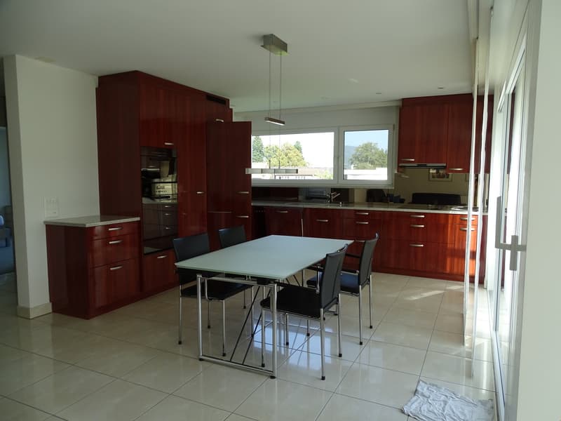 modern kitchen with white floor, large table, chairs, cabinets, electric oven, refrigerator, sink, windows