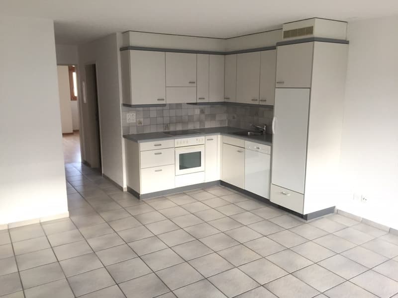 modern kitchen with white cabinets, tiled floor, electric oven, dishwasher, sink, faucet