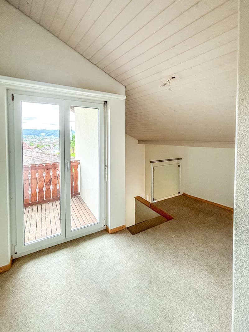 empty room, sliding glass door, balcony, wooden floor, white walls, white ceiling