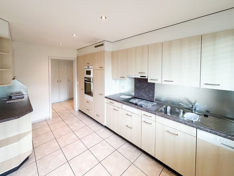 modern kitchen, white cabinets, tiled floor, stainless steel appliances, granite countertops, built-in oven and dishwasher