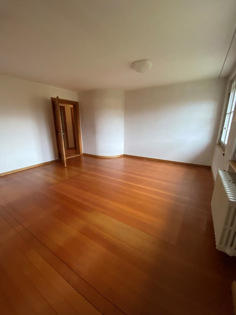 empty room, wooden floors, white walls, opened door, window