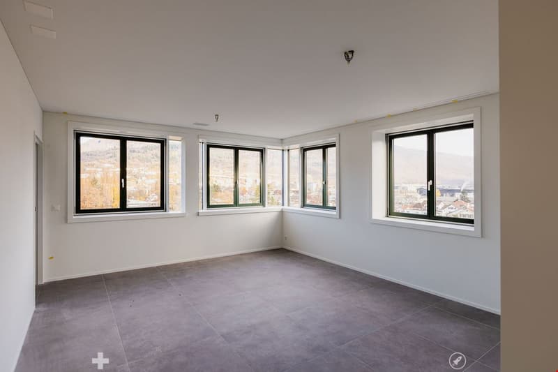empty room, large windows, tiled floor, city view