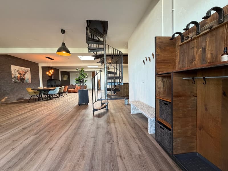 wooden floor, spiral staircase, dining table, chairs, wooden bench, wooden cabinet, hanging lamp