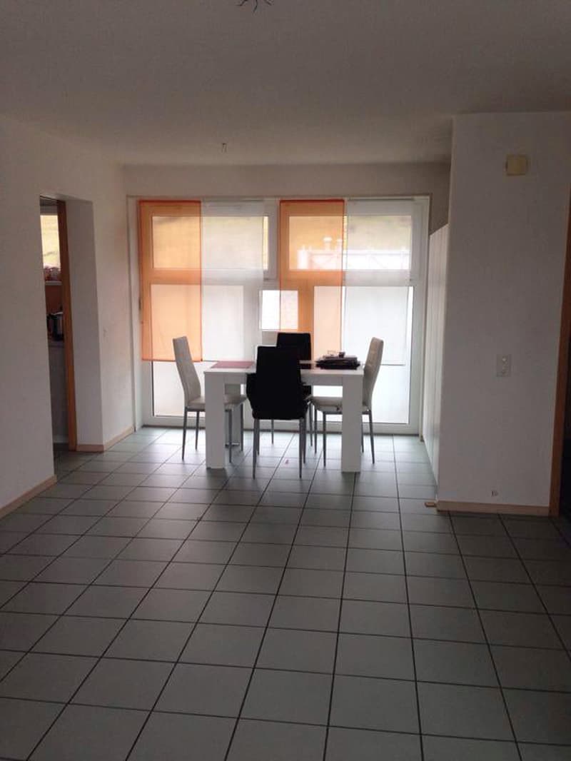 empty room, white table and chairs, tiled floor, large windows, orange curtains