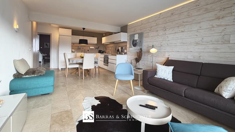 Pièce principale / the interior of a modern apartment with a kitchen and living room