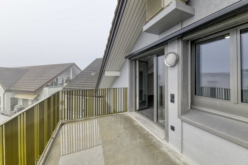 tiled balcony, railings, large glass doors