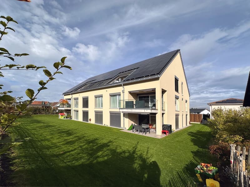 modern house, yellow exterior, solar panels, 3 stories, large garden, patio with outdoor seating, balcony
