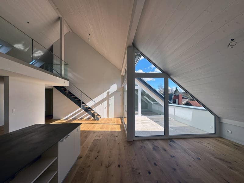spacious attic, large windows, wooden floor, white walls, balcony with stairs