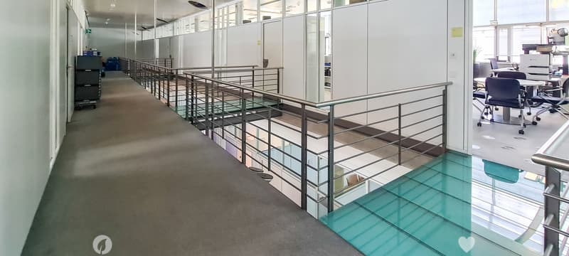 Long corridor, raised ground floor, glass railing, glass floor, white walls