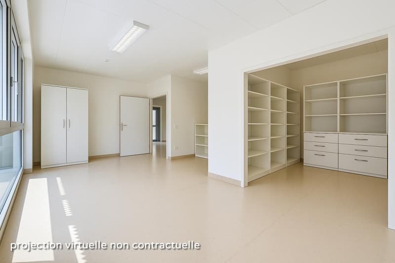 Empty room with white walls, white floor, large windows, built-in wardrobes, shelves, and drawers.