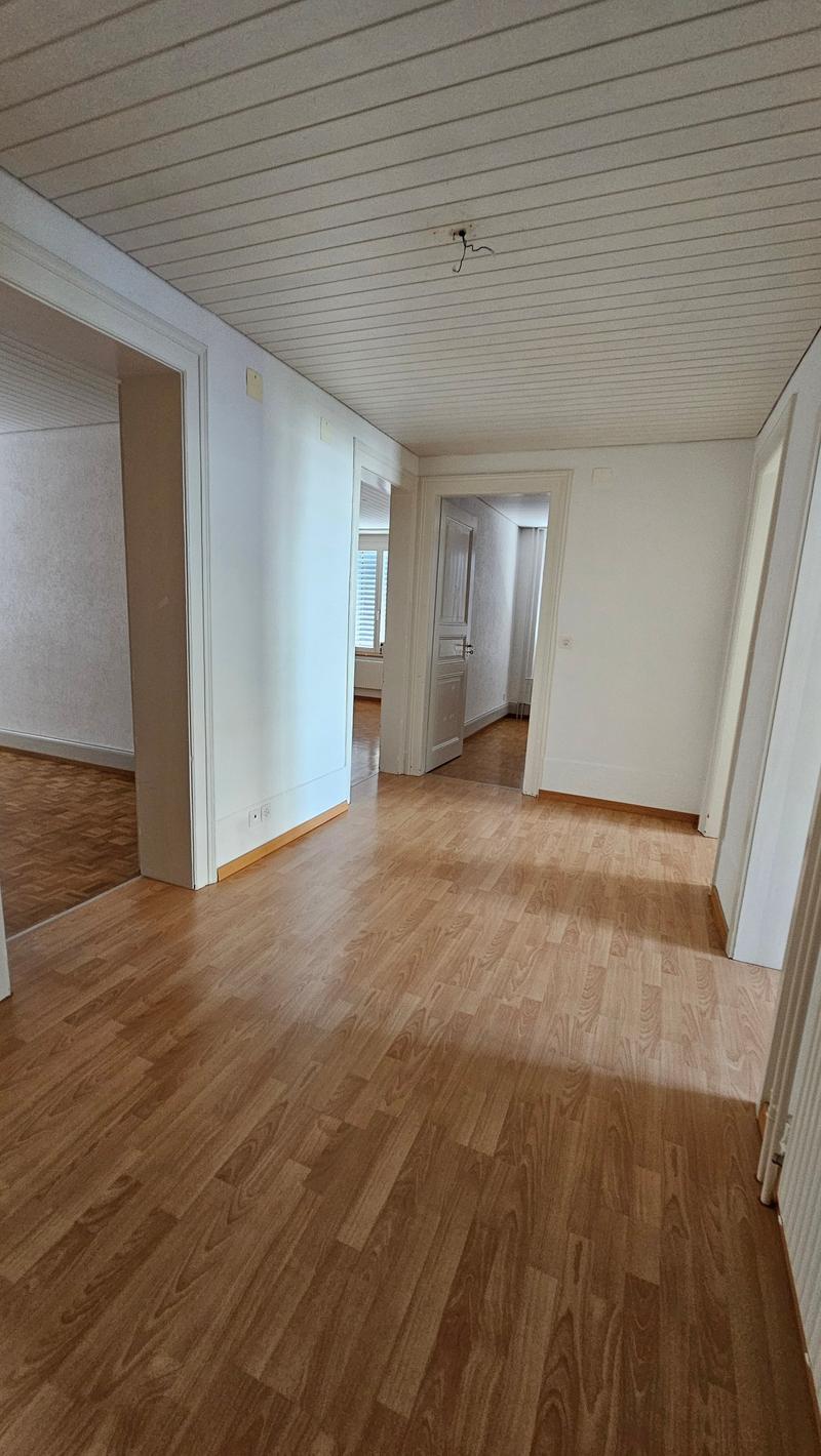 Wooden floor, white walls, 4 rooms, central hallway