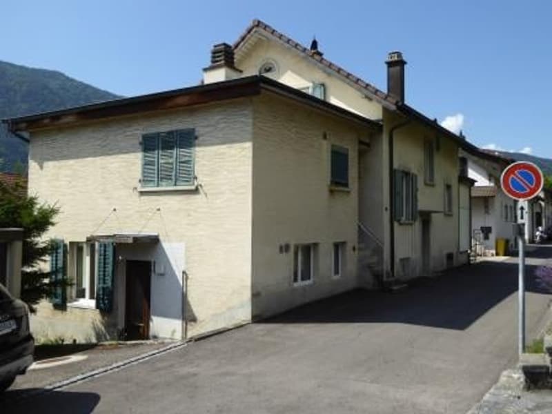 2-story house, white exterior, blue shutters, chimney, parking space in front