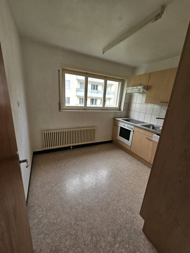 modern kitchen, white tiles, radiator, stainless steel sink, countertop, gas stove, oven, wooden cabinets, double sink