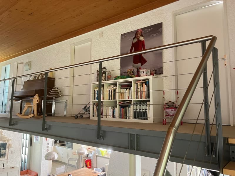 wooden ceiling, balcony, books, piano, child toys