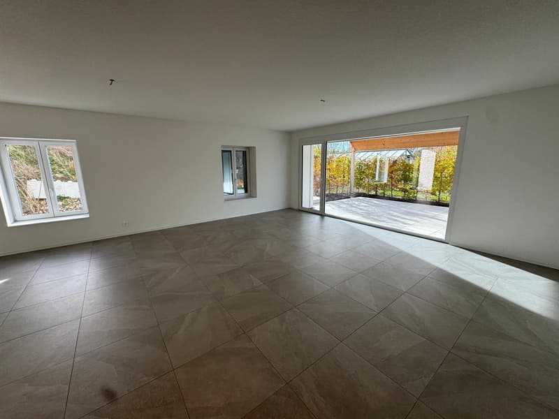 open space, tile flooring, large windows, sliding glass doors, patio, garden view