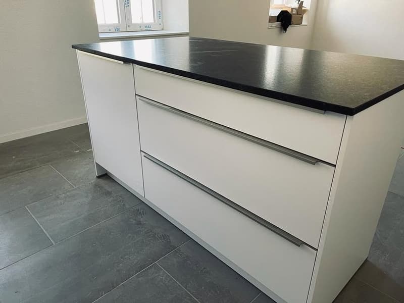 white cabinets, black granite countertop, silver handles