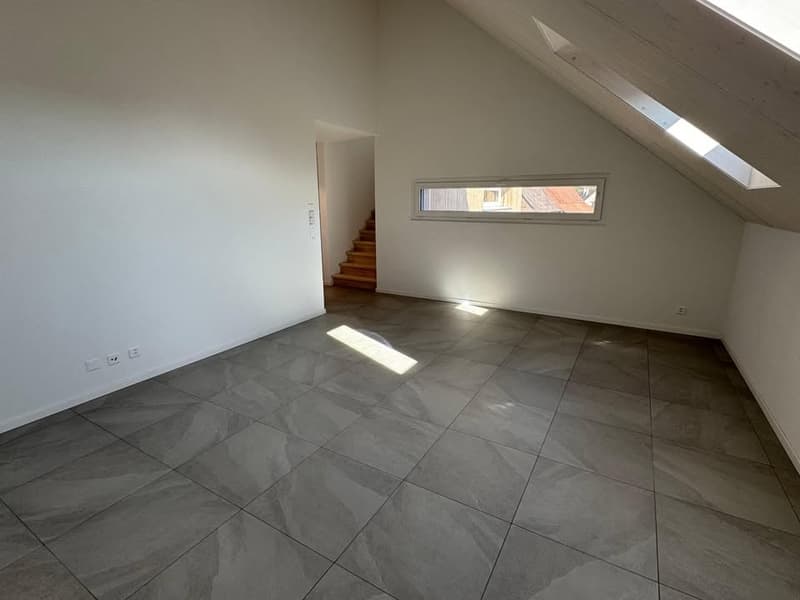 empty room, tiled floor, small attic window, wooden staircase
