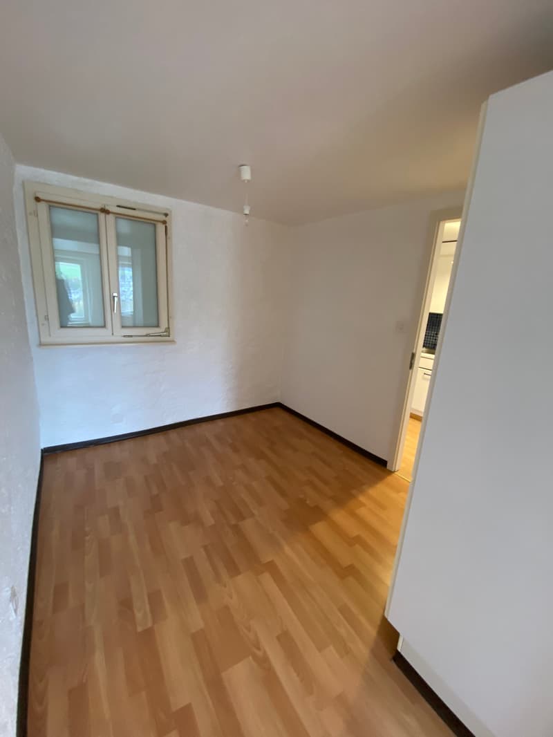 empty room, wooden floor, white walls, window, open door