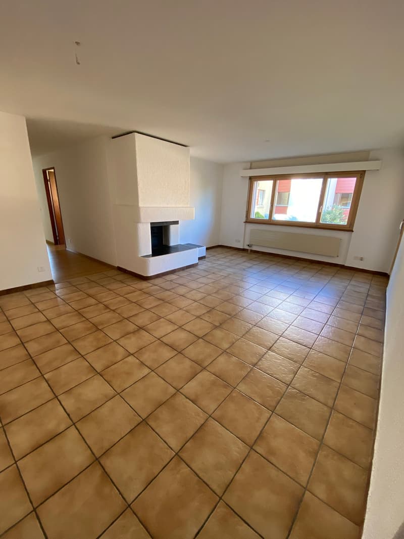 empty room, fireplace, tiled floor, white walls, window