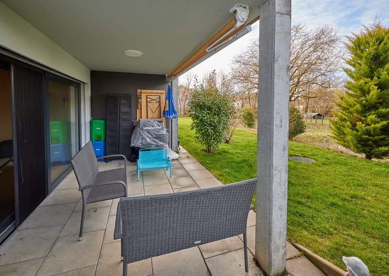 large terrace with garden access, chairs, open storage, covered outdoor table