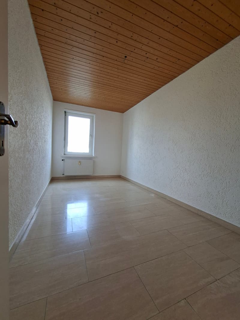 empty room, wooden ceiling, white walls, tiled floor, window, radiator