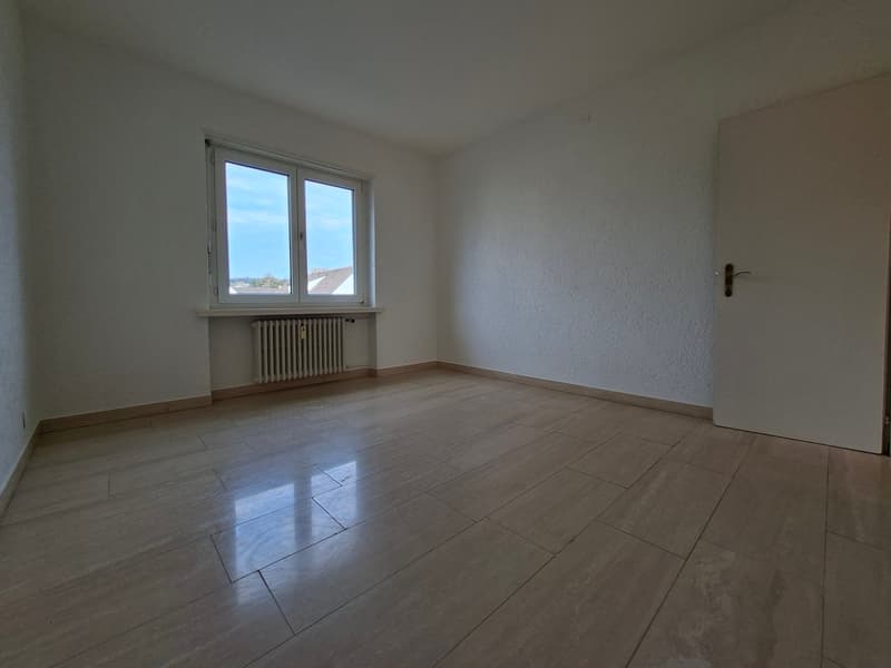 empty room, white walls, wooden floor, window, radiator