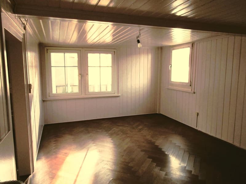 empty room, two windows, wooden floor, white walls