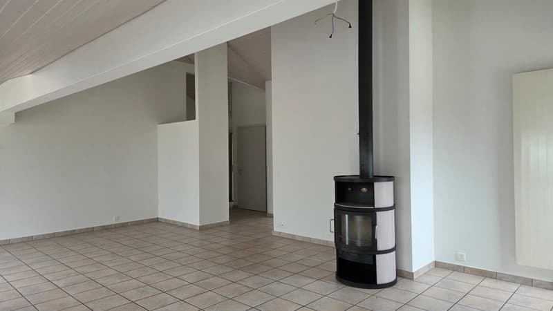 tiled floor, fireplace, white walls, doorway leading to another room
