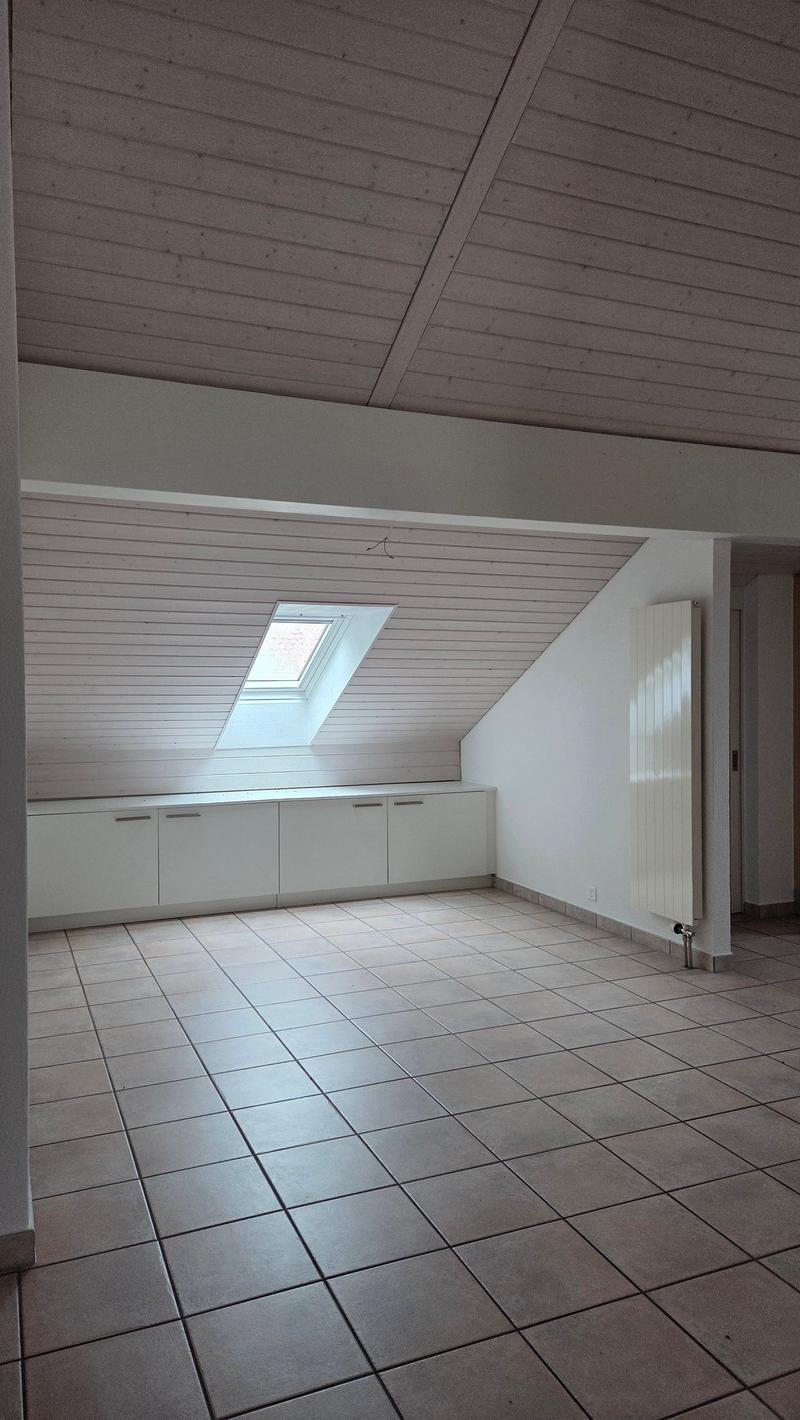 white cabinets, ceiling beams, floor tiles, skylight window, radiator