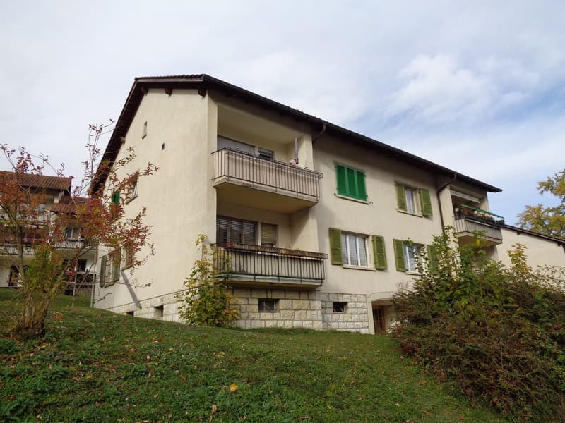 3 story house, beige paint, green shutters, balcony