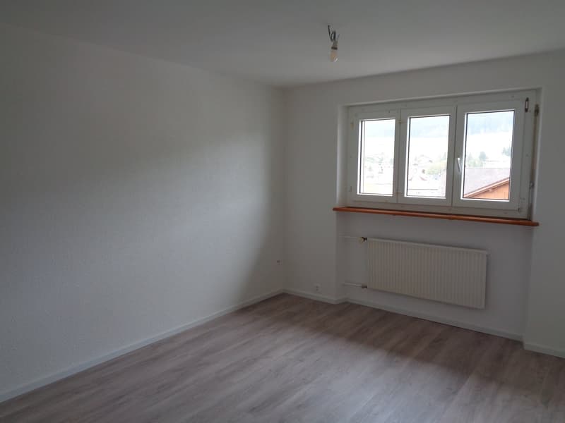 empty room, white walls, wooden floor, large window with view