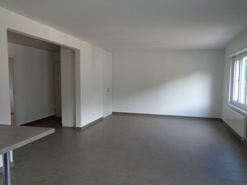 empty room, white walls, tiled floor, window, radiator