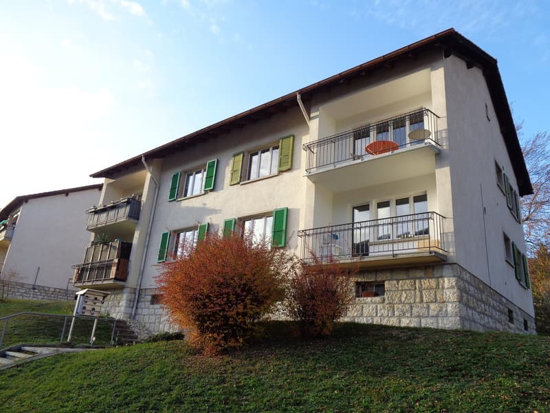 3 story house, white walls, green shutters, balconies, stone foundation