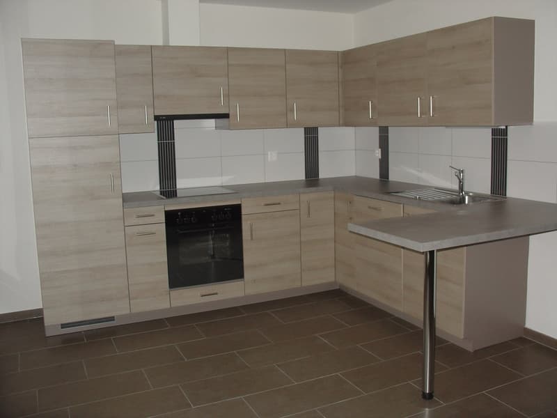 modern kitchen with wooden cabinets, tiled floor, built-in oven, dishwasher, sink, faucet