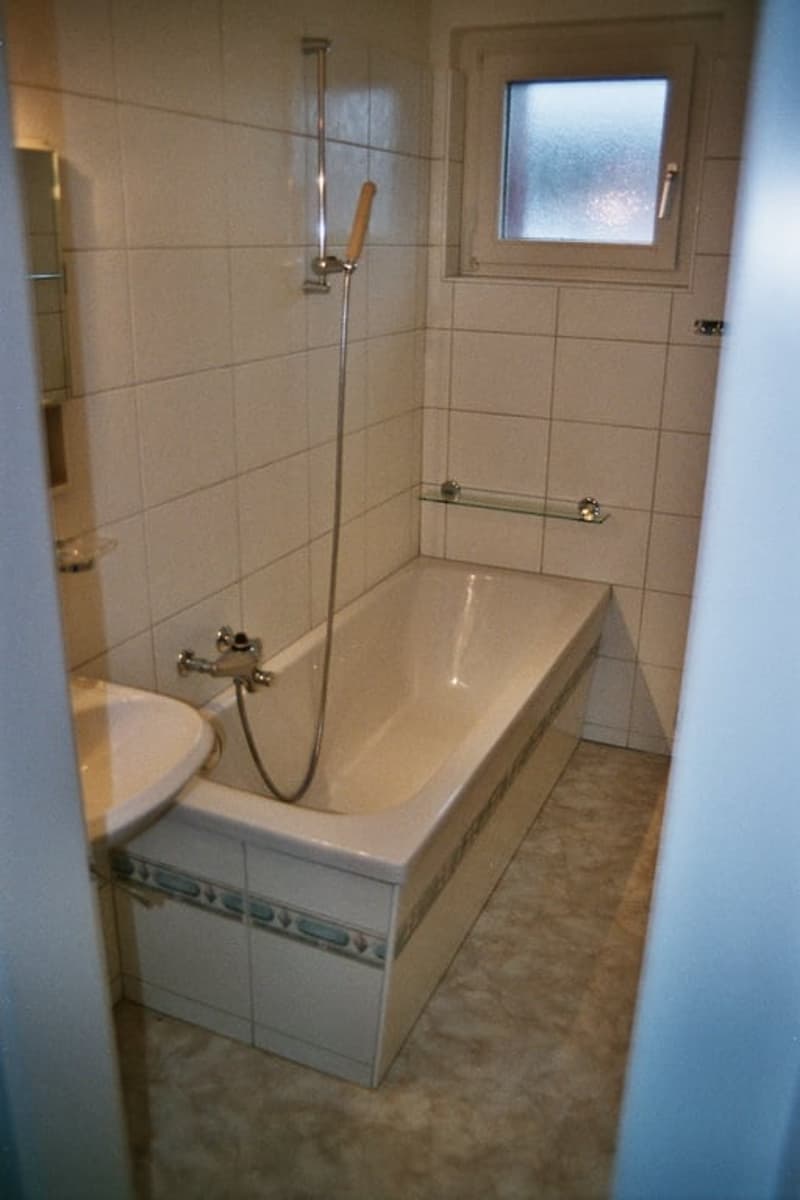 tiled walls, bathtub, shower, sink, small window